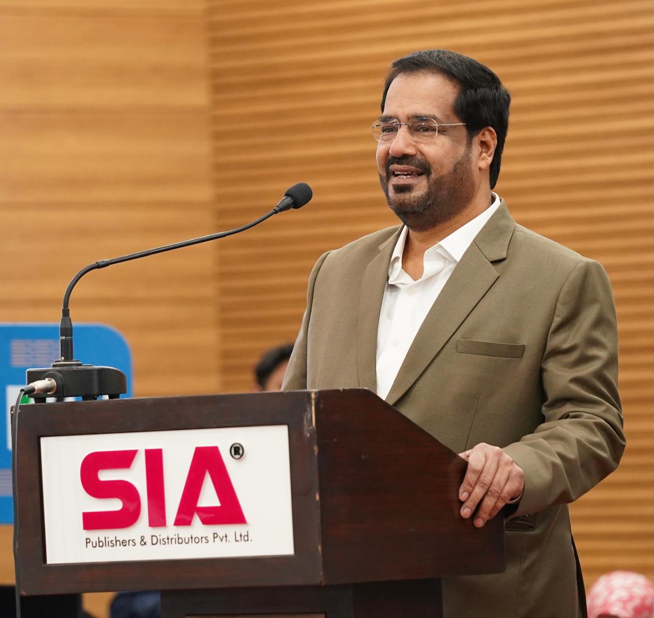 Syed Ibadath Ali speaking at a lectern